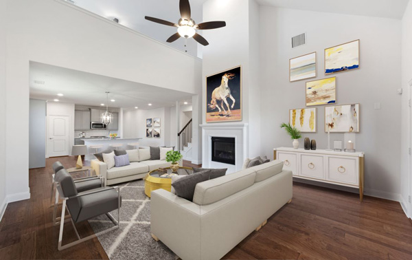 A living room with hardwood floors, a ceiling fan, and reasons why you should move to the suburbs of Dallas.