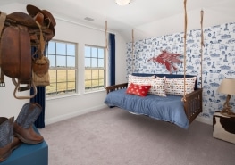 A bedroom with a swing bed and cowboy boots.