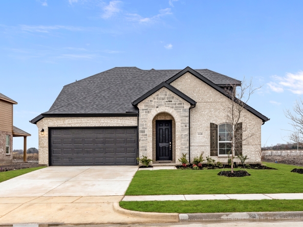 A home at 1120 Longhorn Ln. with a garage and a driveway.
